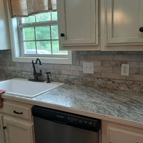 Grey tile backsplash installation