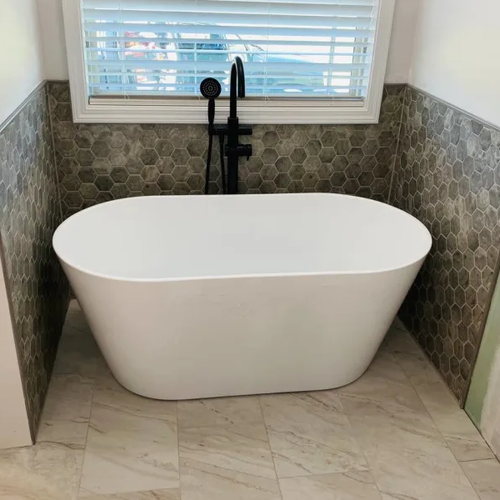 Honeycomb tile in a bathroom by Absolute Flooring Inc