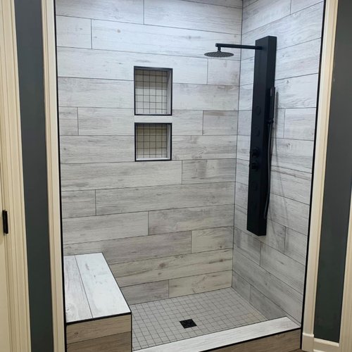 Shower with wood-look tile walls